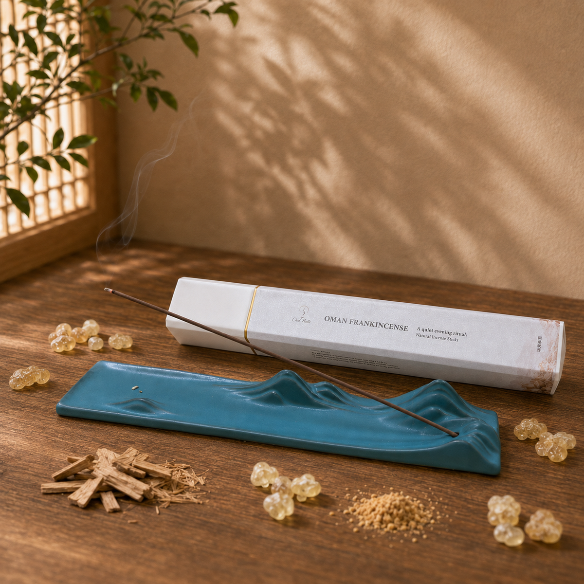 Omani Frankincense 50g incense box with a dark green landscape holder and resin pieces