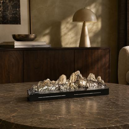 Landscape glass incense box on a dark stone coffee table