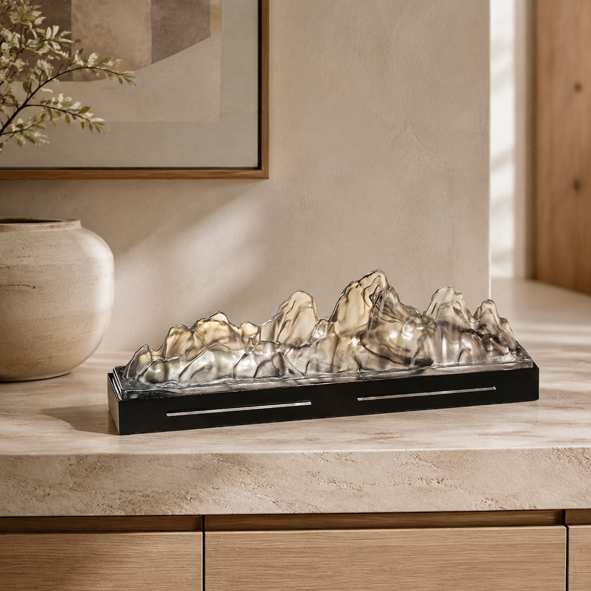 Landscape glass incense box on a pale stone console table