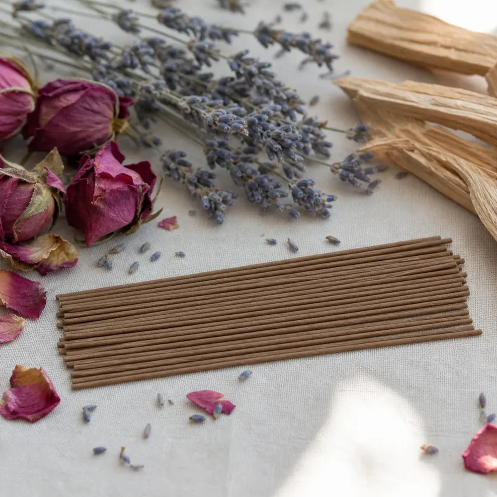Incense sticks with dried roses, lavender and wood pieces